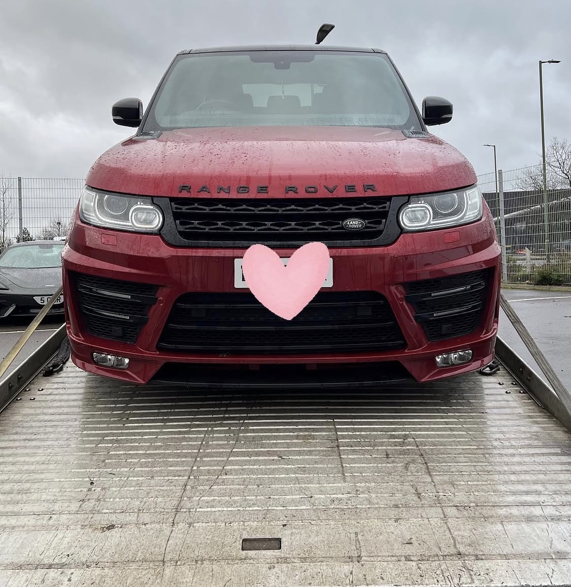 Range Rover on recovery truck